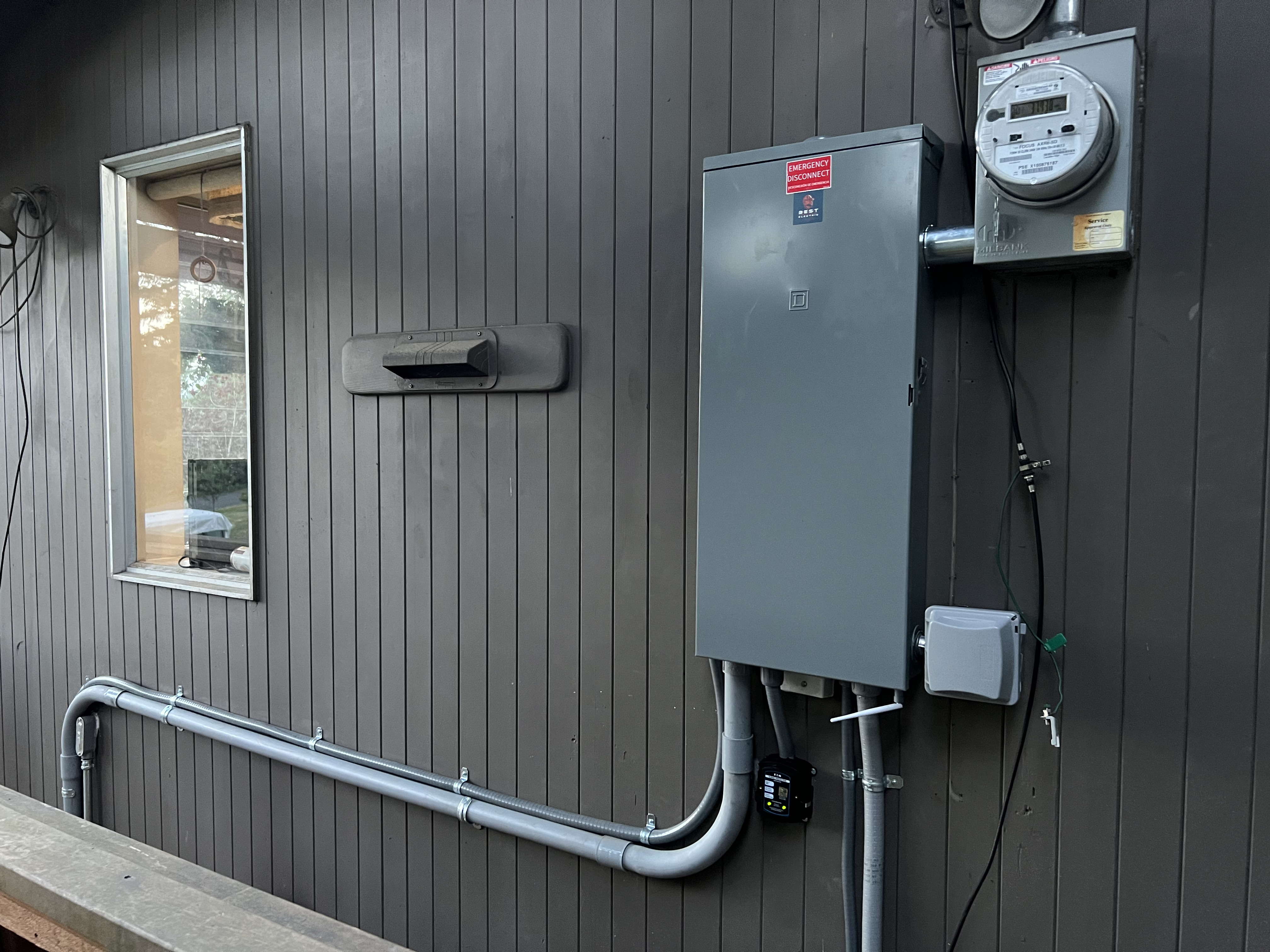 Blessed Electrical Service Team member working on an electrical panel